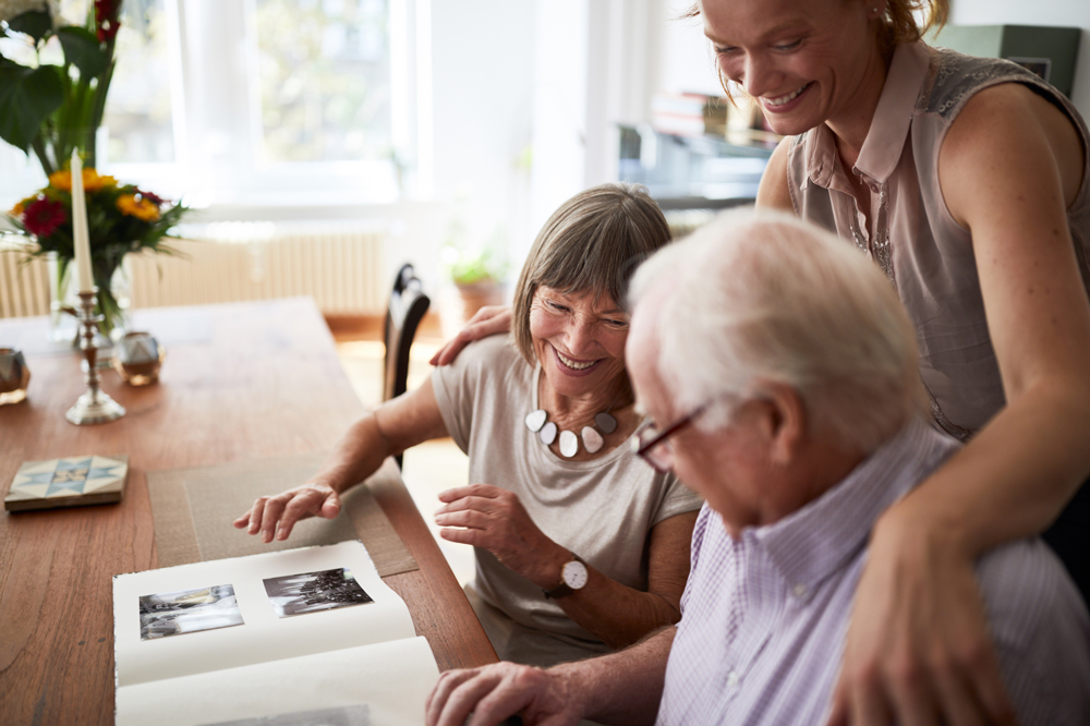 Older adult family looking at photos